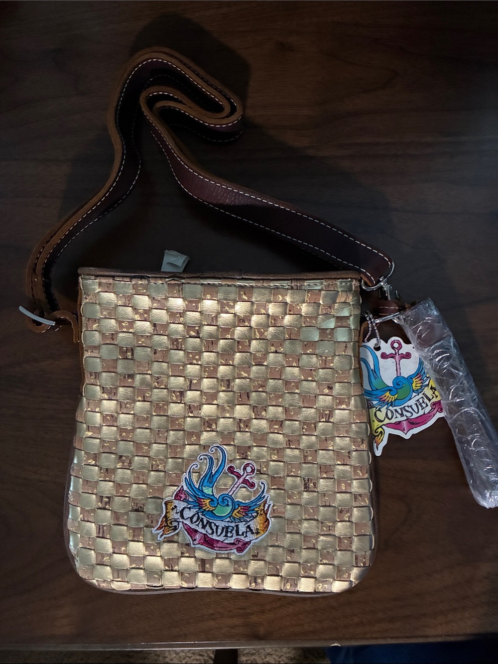 Consuela Gold Woven Crossbody Bag with Colorful Logo Patch